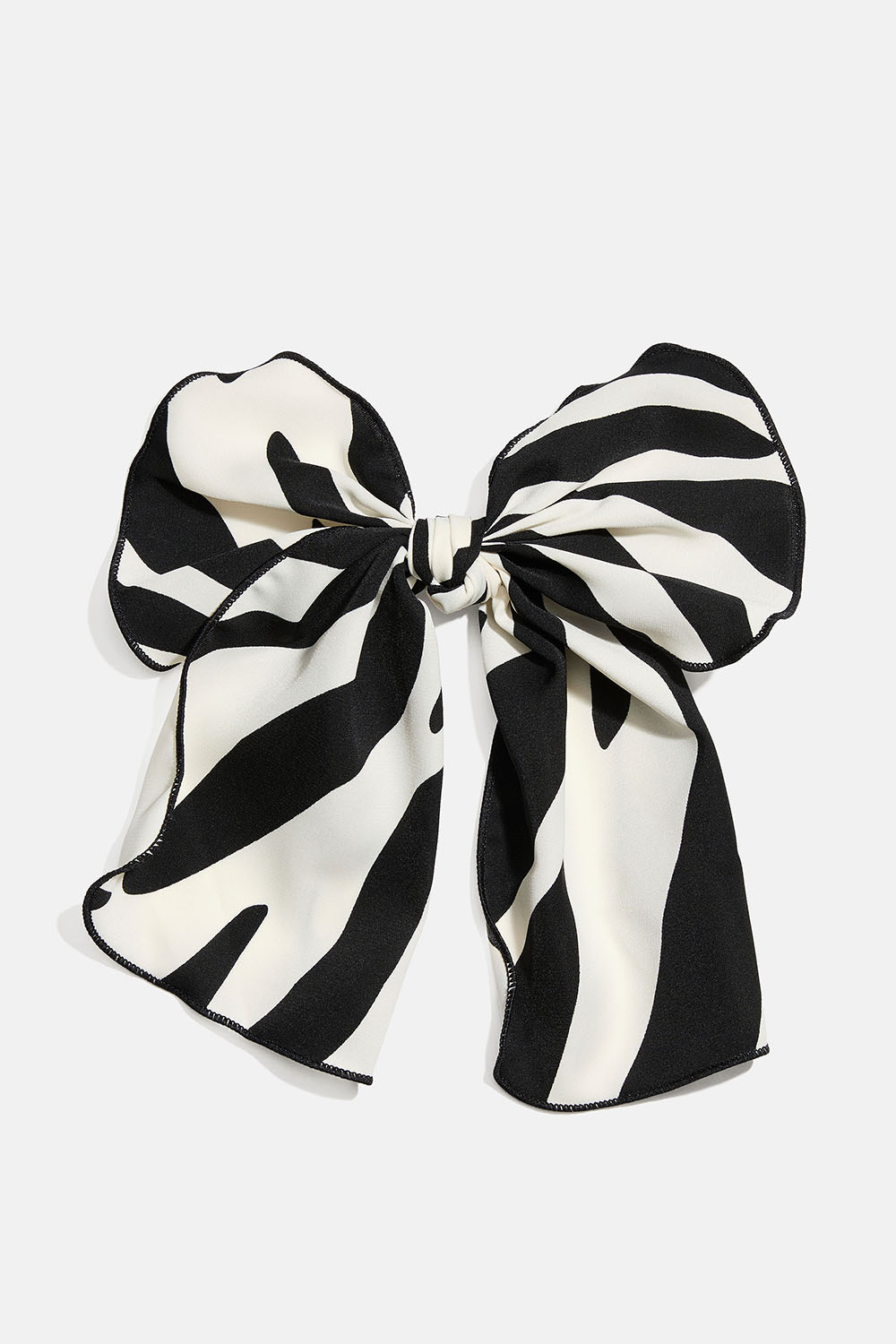 Hårspenne med sløyfe i sebramønstret stoff