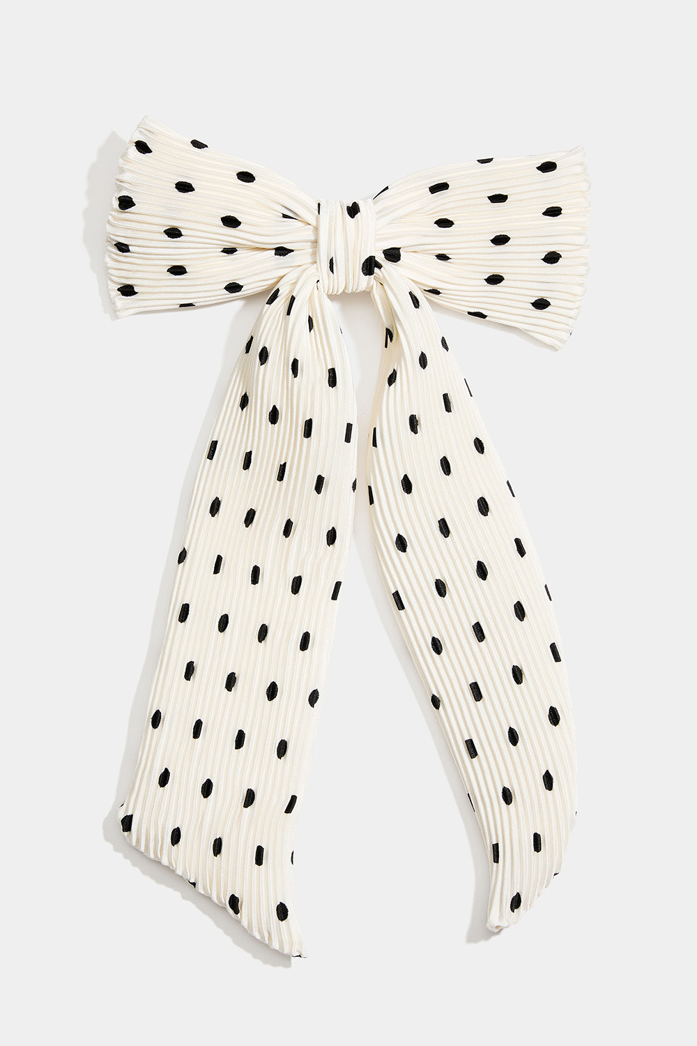 Hårspenne med hvit, plissert sløyfe med prikker