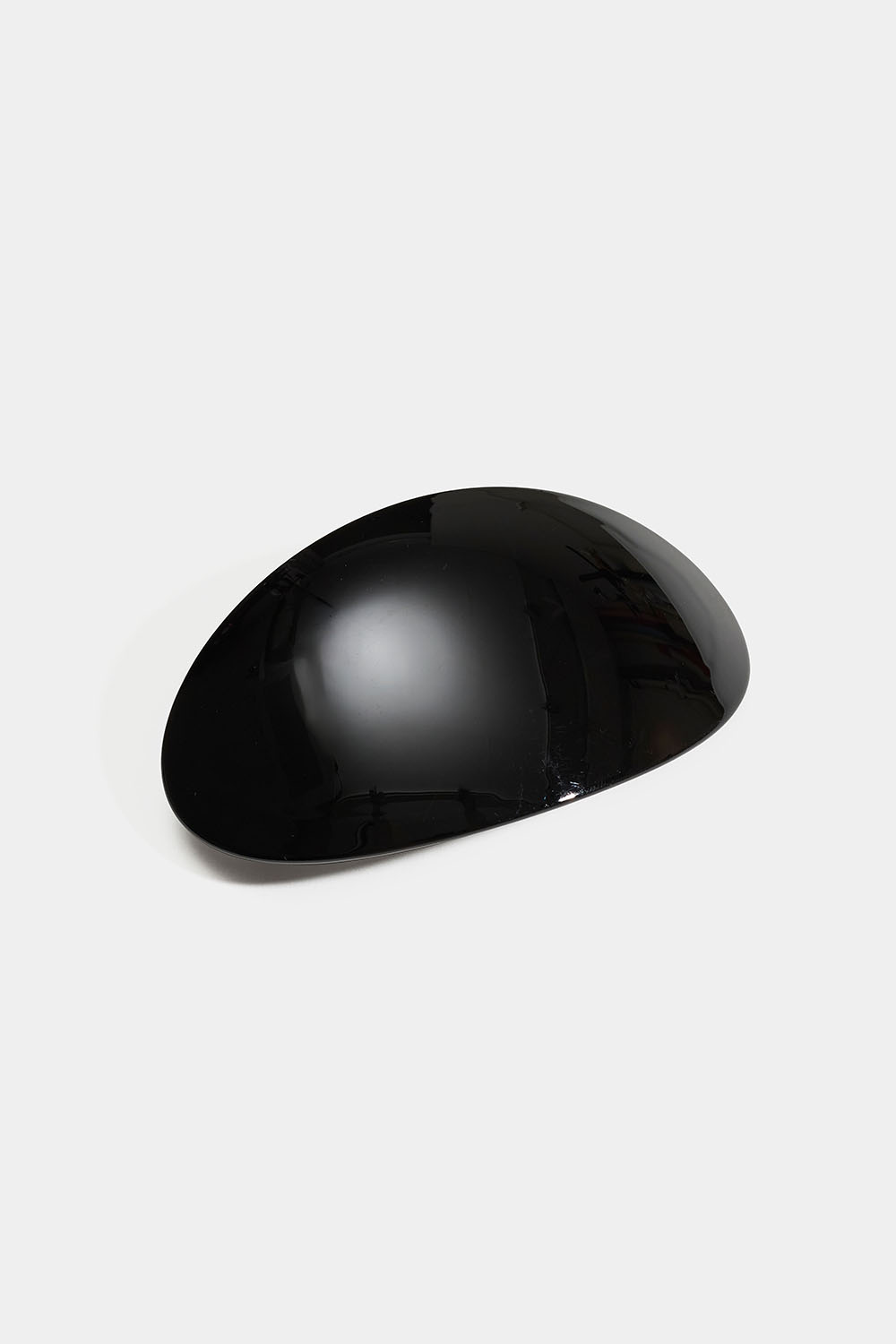 Oval svart hårspenne