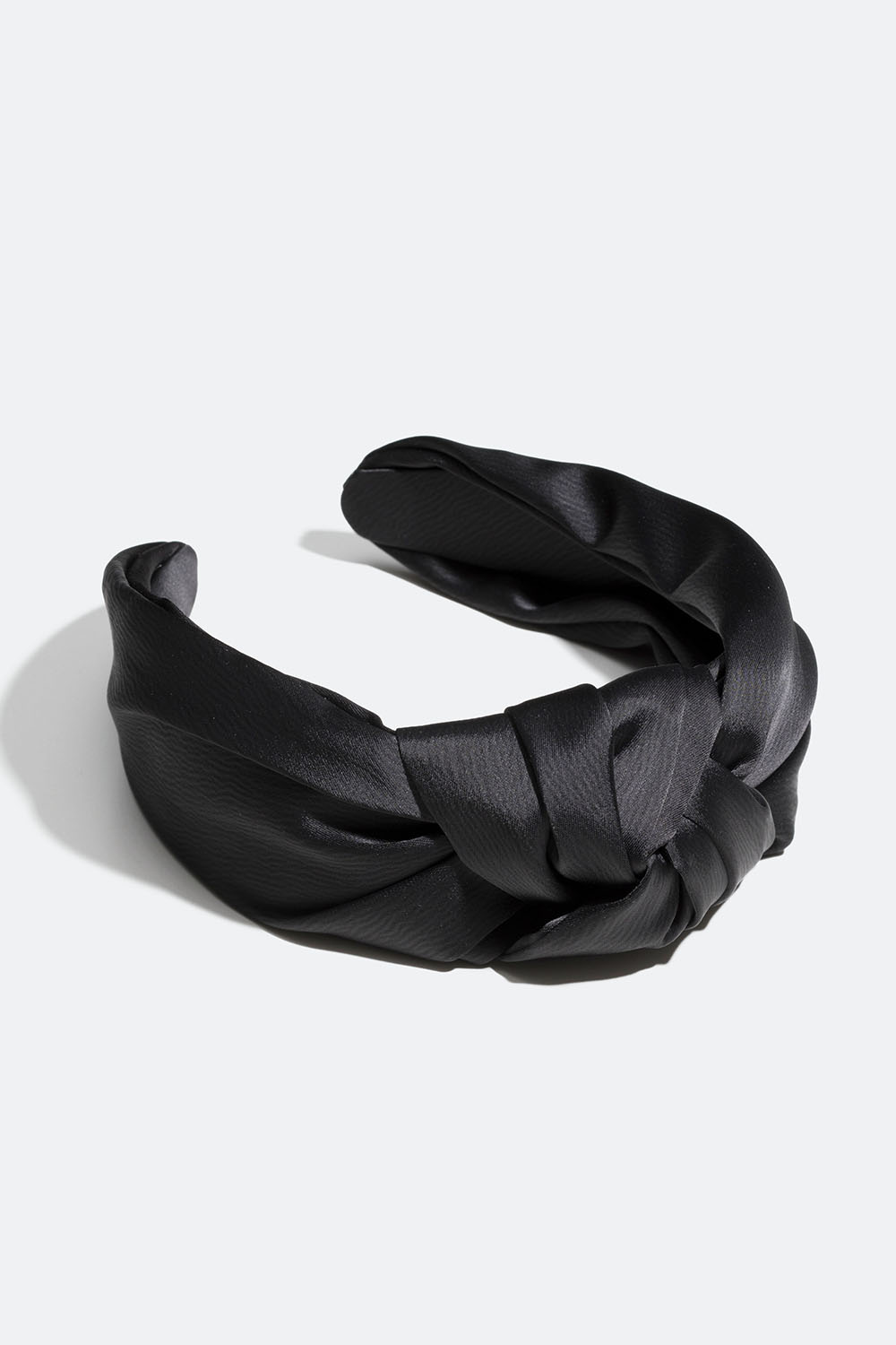 Svart hårbøyle med stor knute