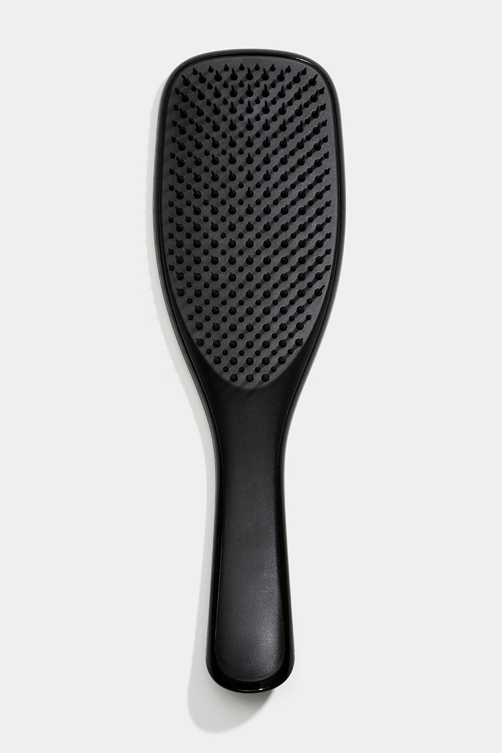 Svart hårbørste mot floker