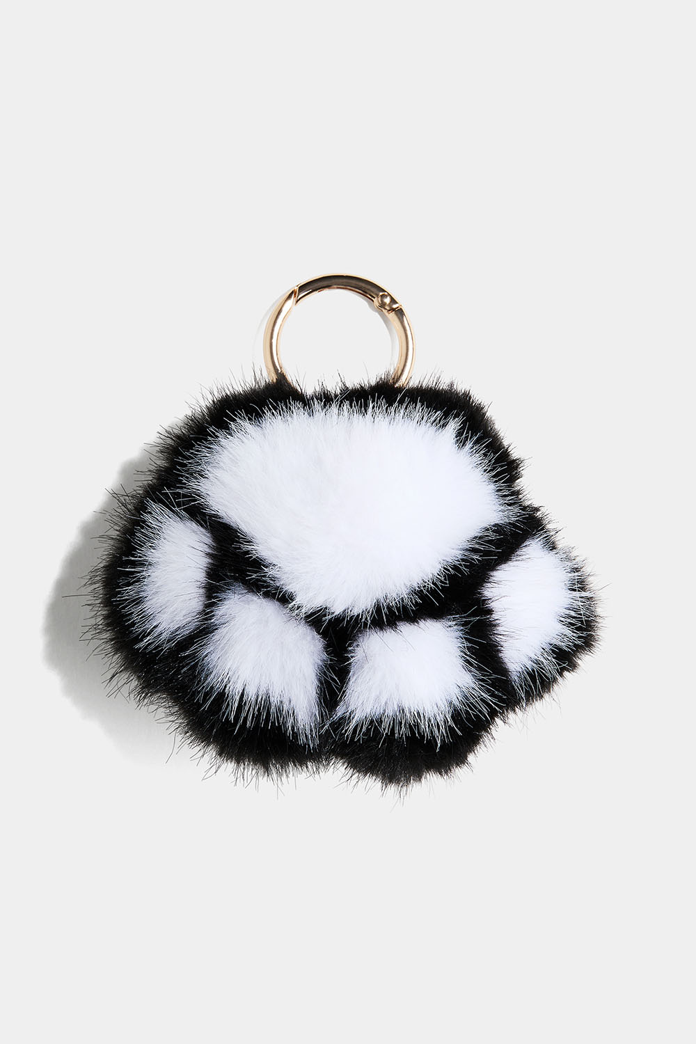Nøkkelring med fluffy pote i svart og hvitt