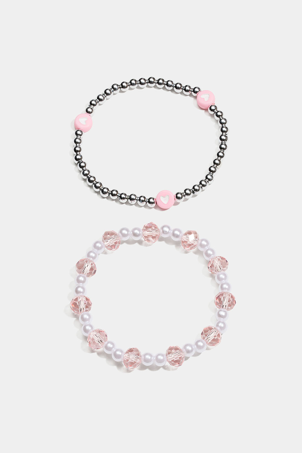 Elastiske armbånd med perler i rosa, hvitt og sølvfarge
