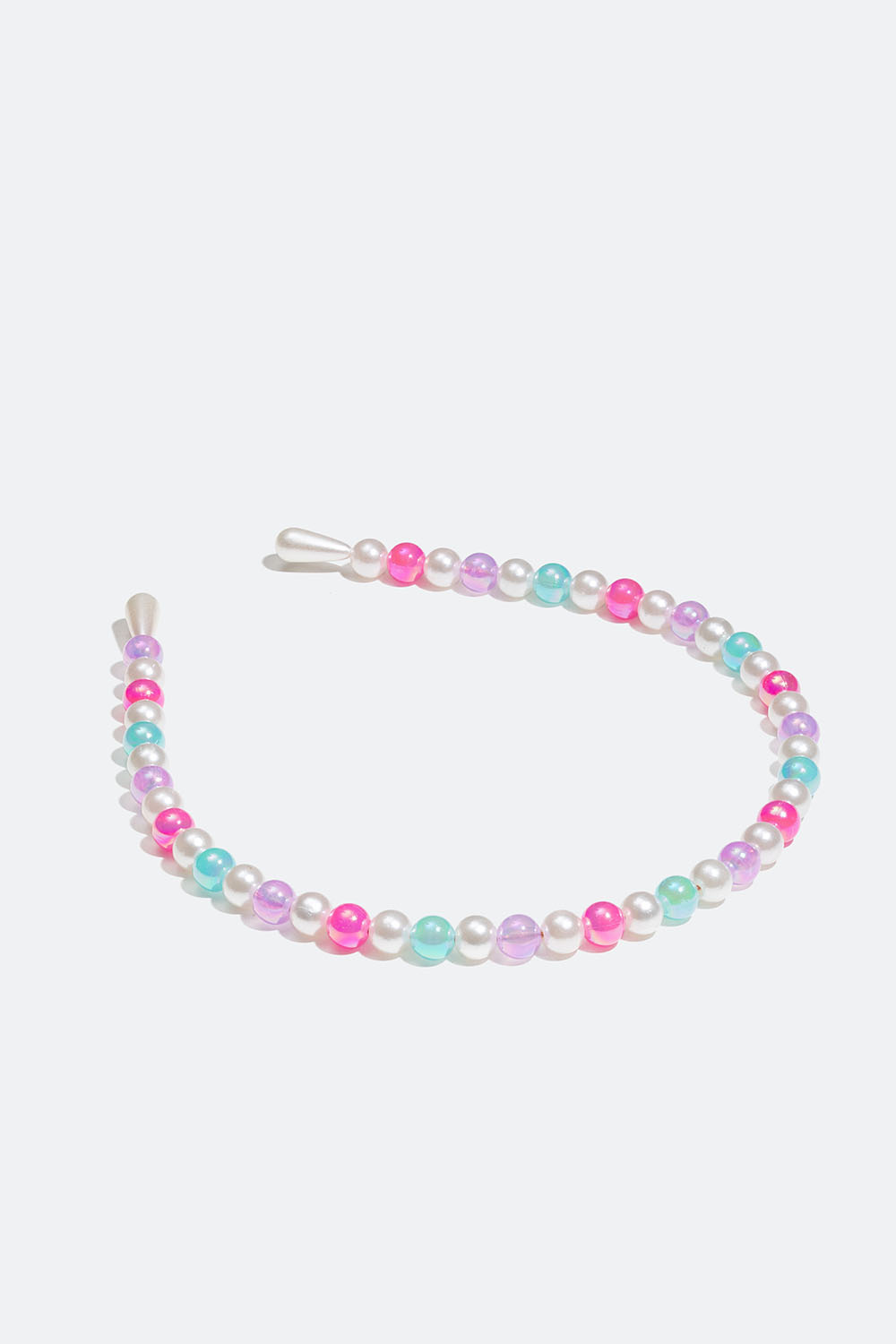 Hårbøyle med perler i forskjellige farger