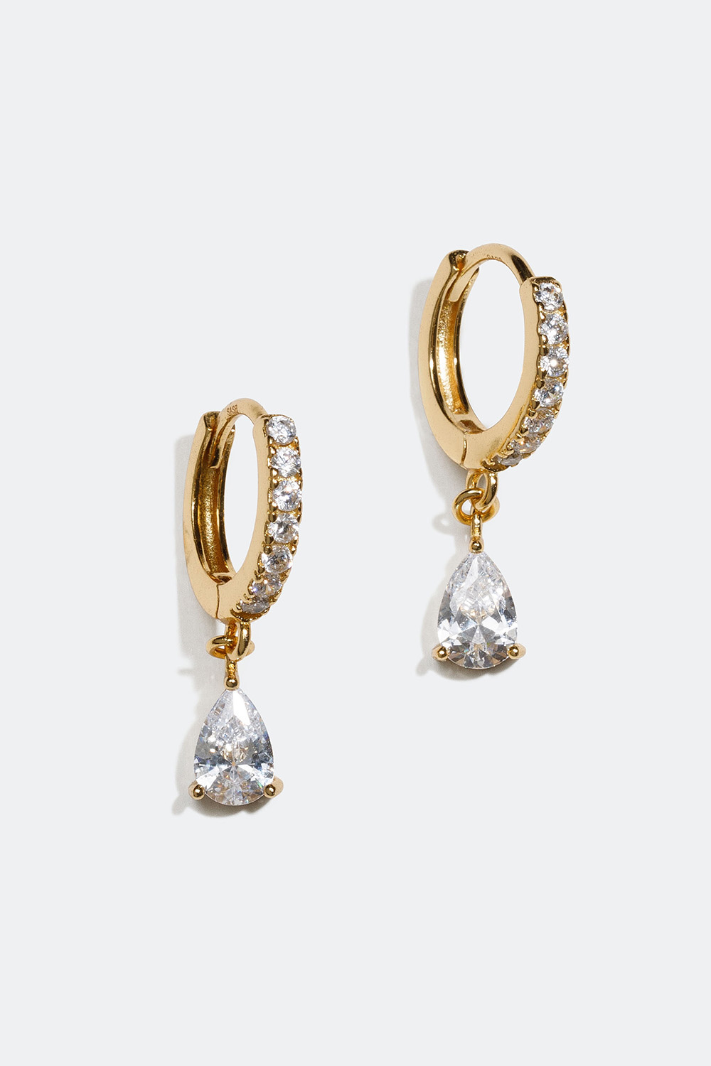 Miniøreringer forgylt med 18k gull og hvite dråpeformede steiner